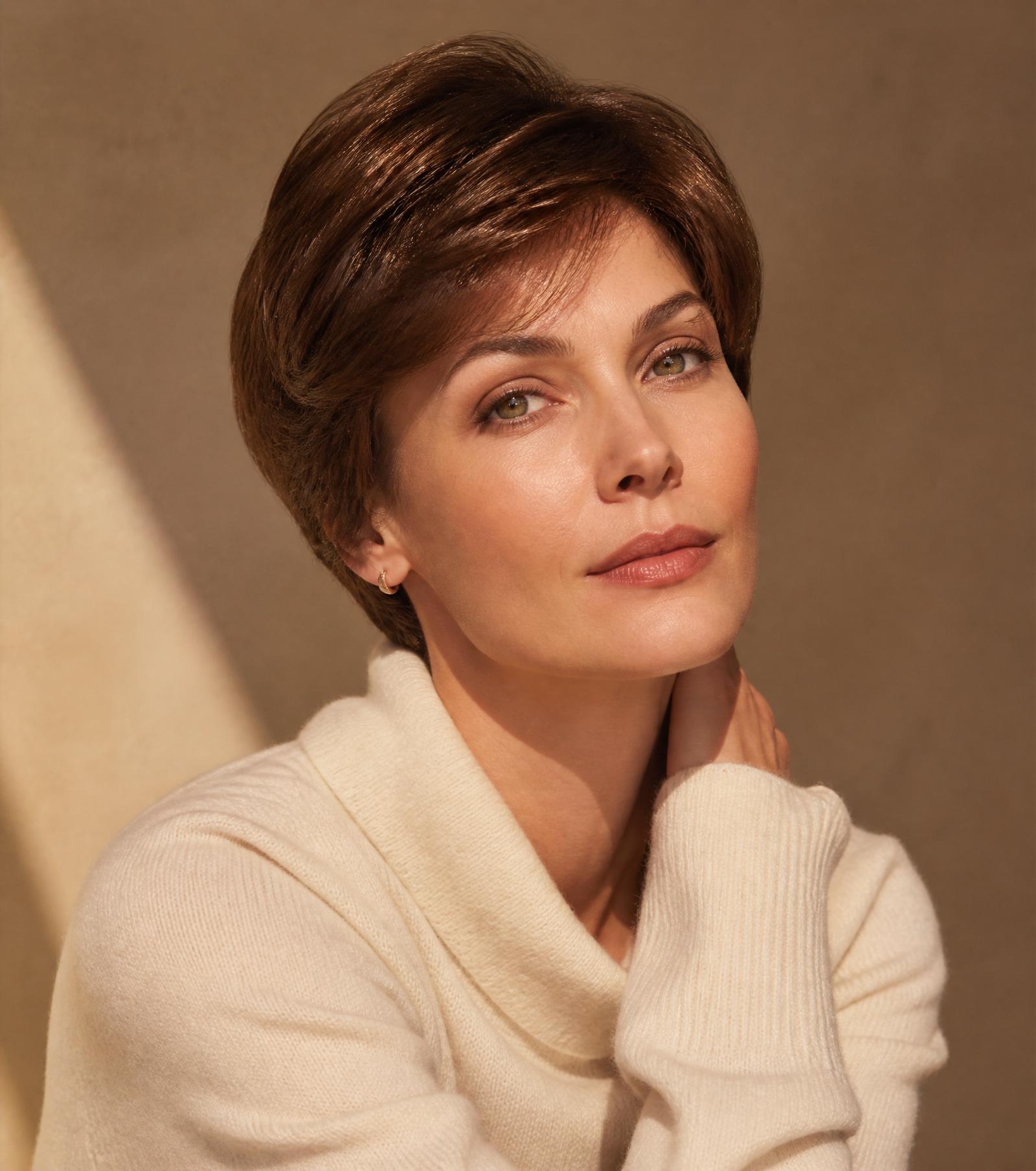 A woman wearing a short brown virgin European hair wig